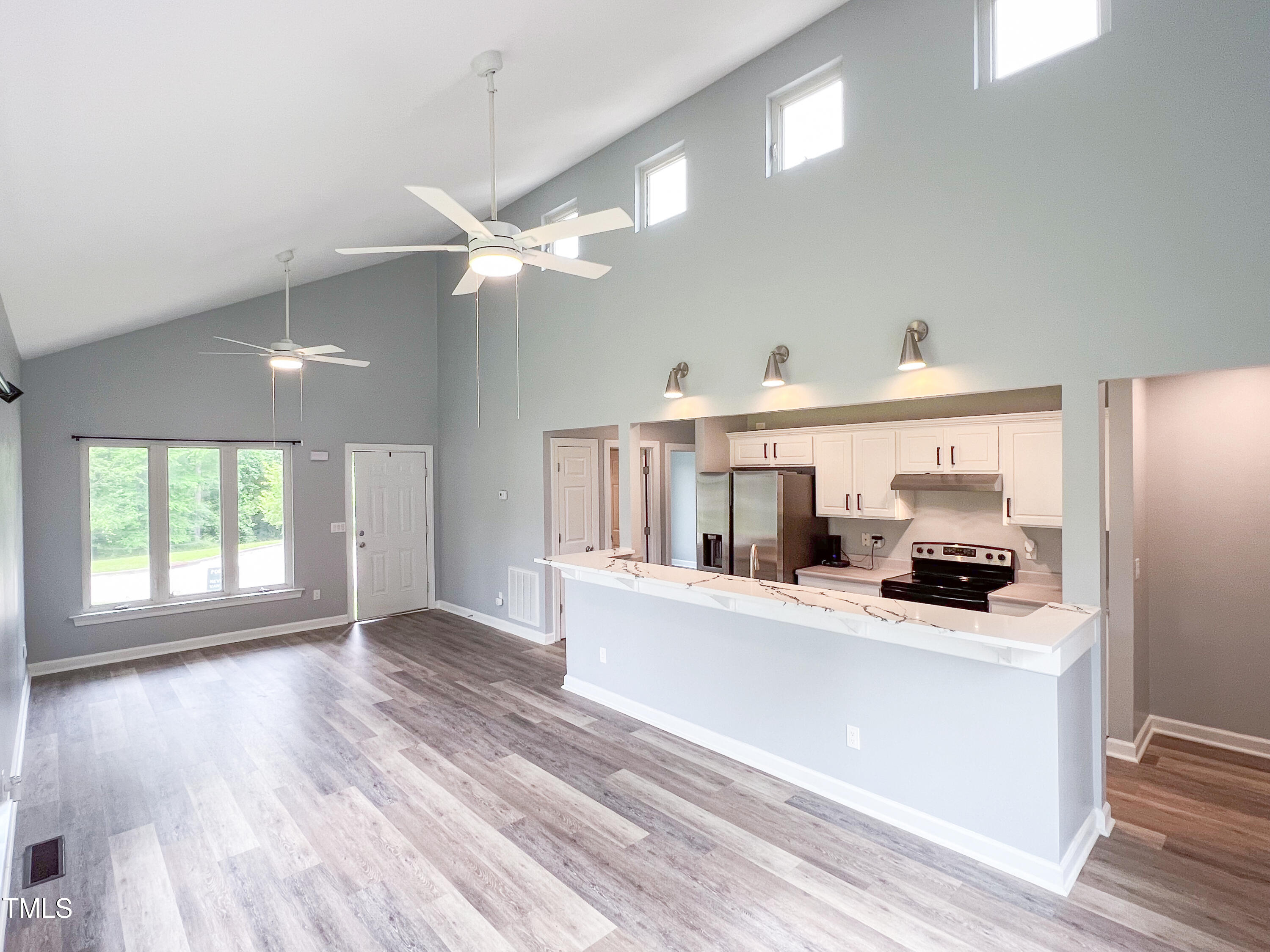 1809 Coltrane Court Raleigh, NC 27610 - Photo 3 of 13 a view of a living room a window and kitchen view