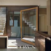 a bathroom with a glass shower door