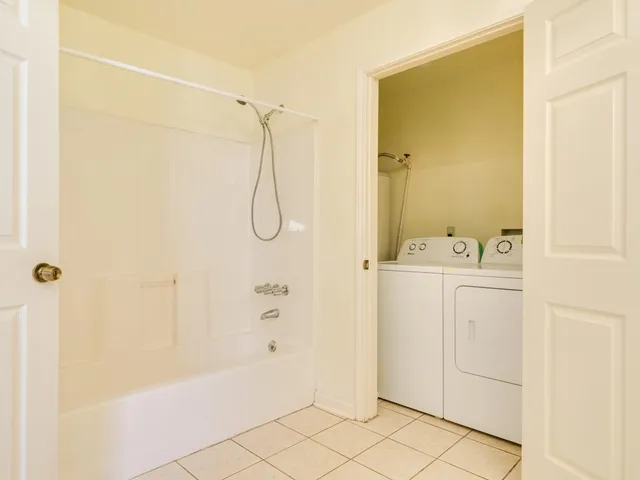 a bathroom with a shower and a shower