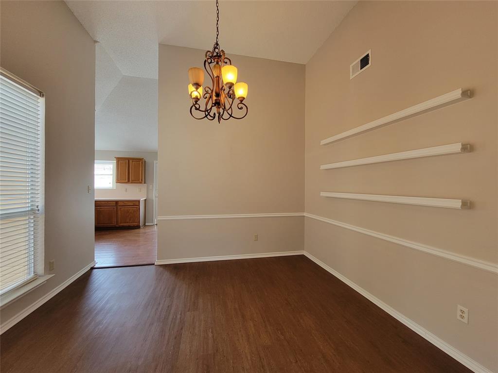 2104 Birch Bend Mesquite, TX 75181 - Photo 4 of 13 a view of a room with wooden floor and ceiling fan