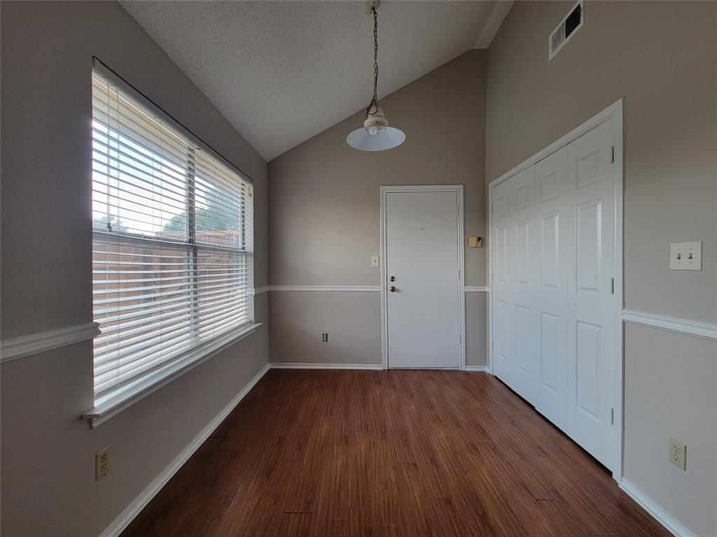 2104 Birch Bend Mesquite, TX 75181 - Photo 5 of 13 a view of a room with wooden floor and windows