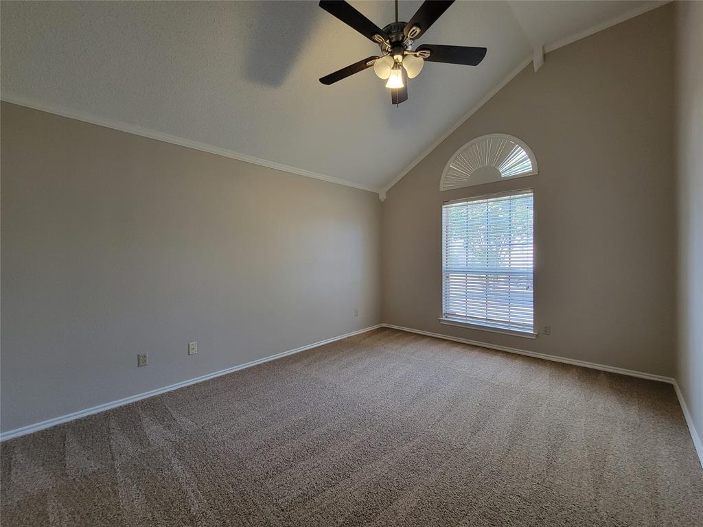 2104 Birch Bend Mesquite, TX 75181 - Photo 6 of 13 an empty room with windows and chandelier fan