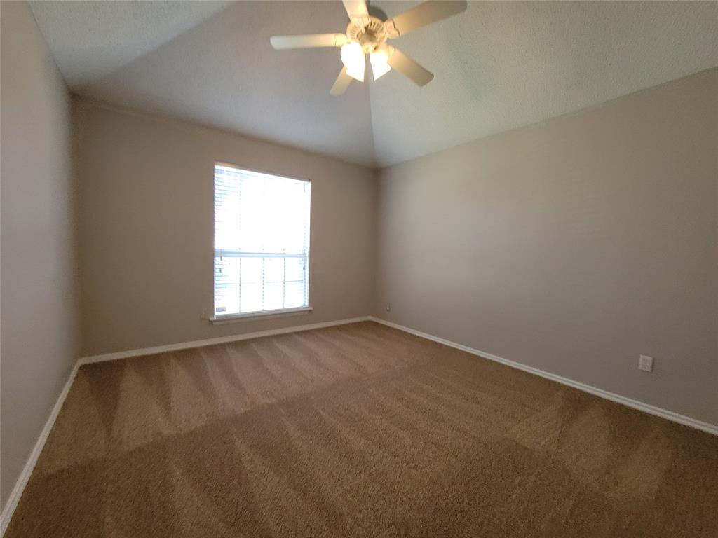 2104 Birch Bend Mesquite, TX 75181 - Photo 10 of 13 an empty room with a window and a fan