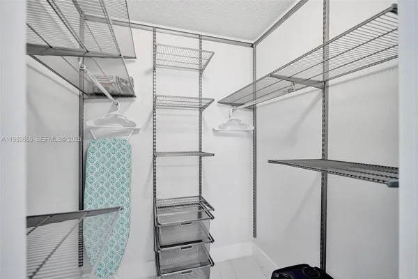 a bathroom with a shower and a glass door