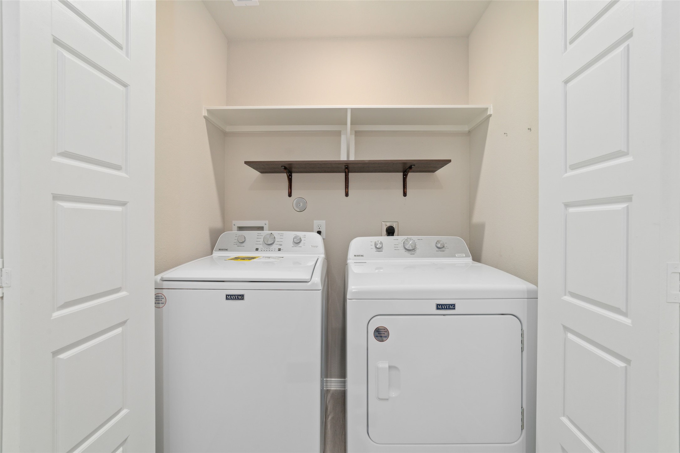 14232 Shasta Ridge Drive Conroe, TX 77303 - Photo 20 of 26 Dedicated laundry space with overhead shelving for added storage and everyday convenience.