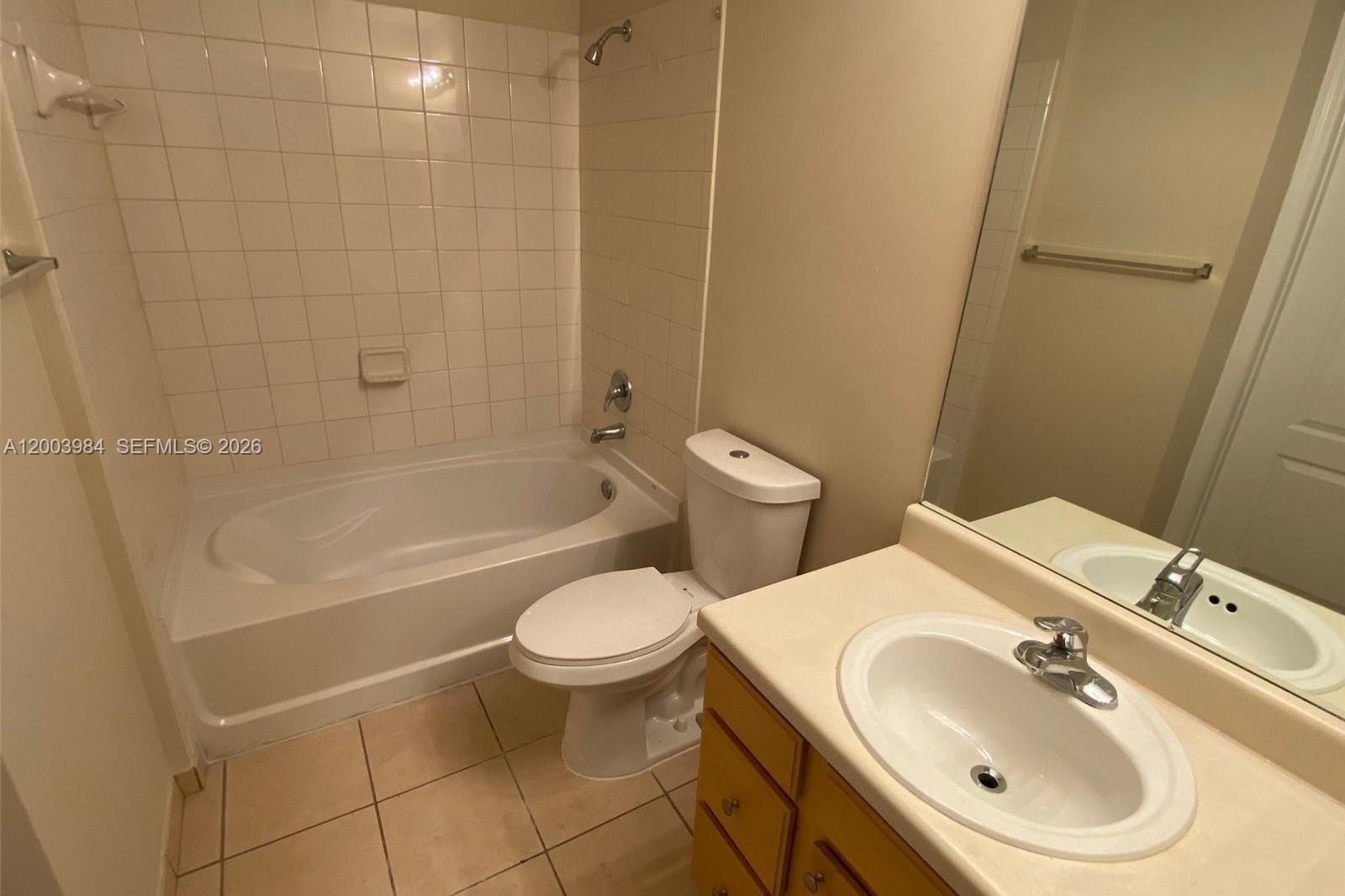 6001 Southwest 70th Street, Unit 342 South Miami, FL 33143 - Photo 10 of 19 a bathroom with a sink toilet and shower