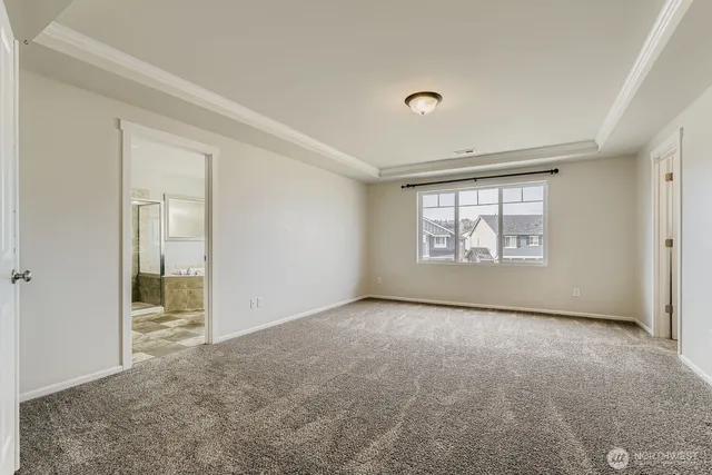 a bathroom with a sink a toilet a mirror and shower