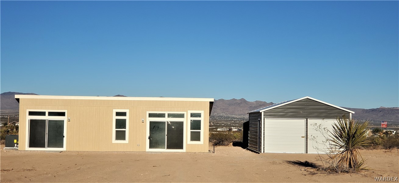 1434 Dilcon Road Golden Valley, AZ 86413 - Photo 1 of 49 a front view of a house with a yard
