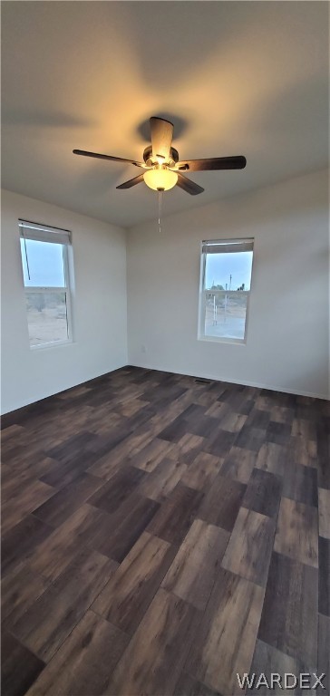 1434 Dilcon Road Golden Valley, AZ 86413 - Photo 15 of 49 an empty room with wooden floor and windows