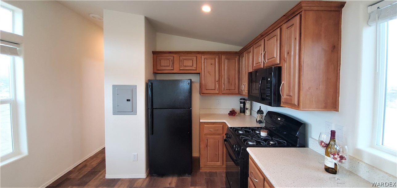 1434 Dilcon Road Golden Valley, AZ 86413 - Photo 20 of 49 a kitchen with stainless steel appliances granite countertop a refrigerator and a sink