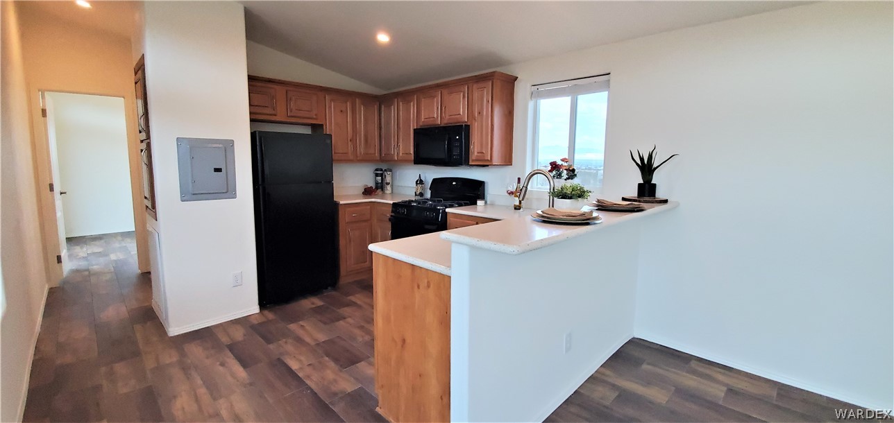 1434 Dilcon Road Golden Valley, AZ 86413 - Photo 21 of 49 a kitchen with a refrigerator sink and cabinets