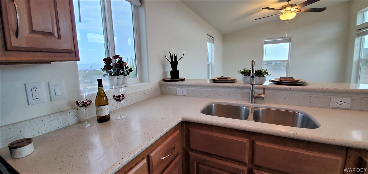 1434 Dilcon Road Golden Valley, AZ 86413 - Photo 26 of 49 a kitchen with a sink and a refrigerator