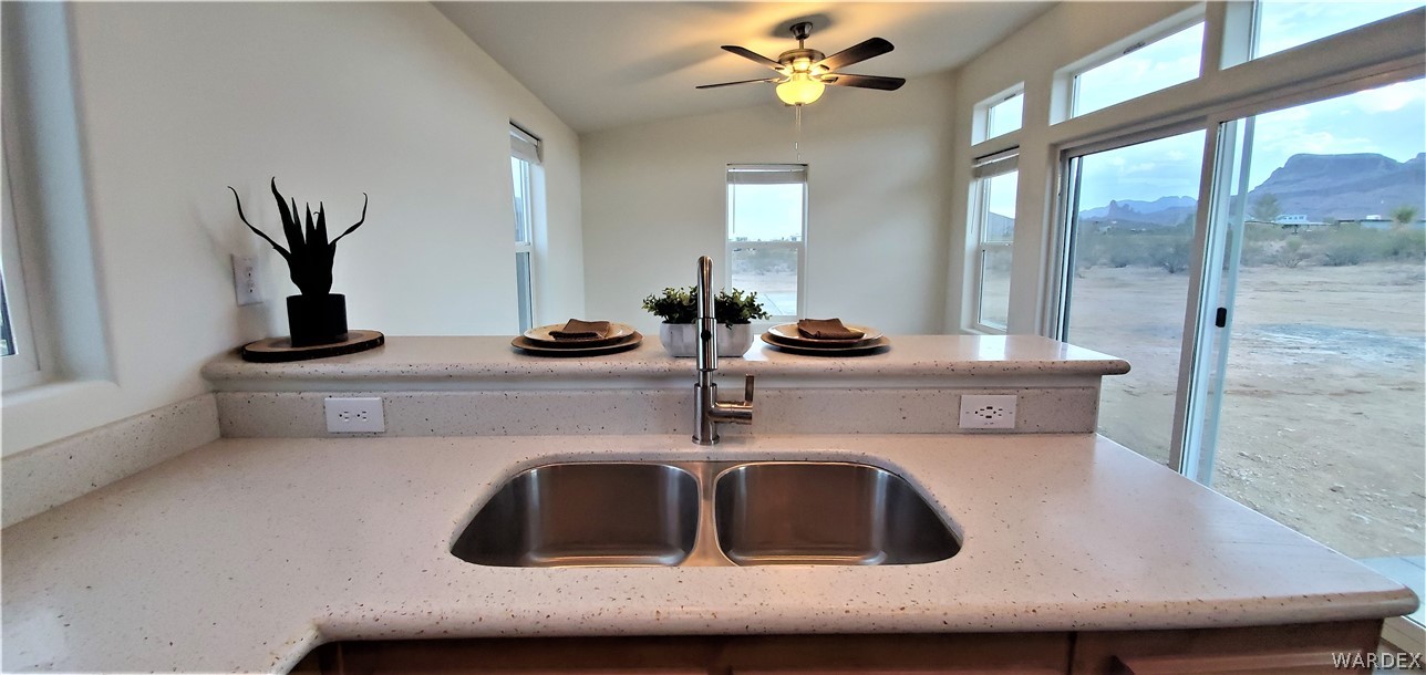1434 Dilcon Road Golden Valley, AZ 86413 - Photo 27 of 49 a kitchen with a sink and a mirror