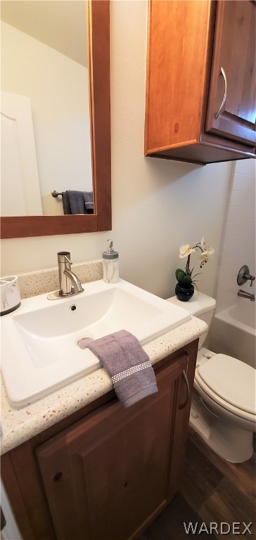 1434 Dilcon Road Golden Valley, AZ 86413 - Photo 31 of 49 a bathroom with a sink a toilet and mirror