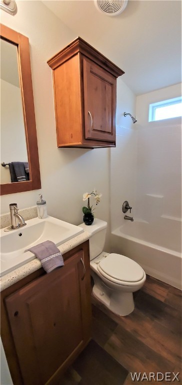 1434 Dilcon Road Golden Valley, AZ 86413 - Photo 33 of 49 a bathroom with a sink a toilet and mirror