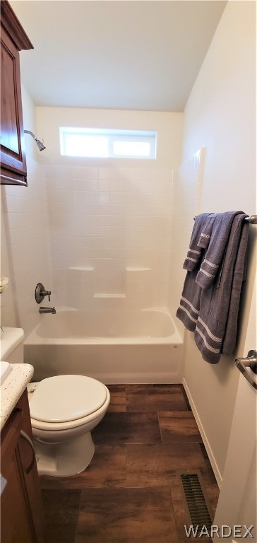 1434 Dilcon Road Golden Valley, AZ 86413 - Photo 35 of 49 a bathroom with a toilet a sink and bathtub