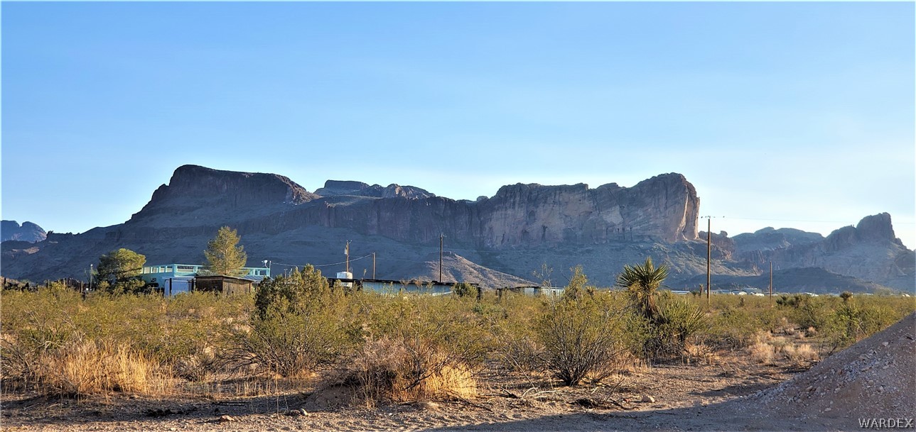 1434 Dilcon Road Golden Valley, AZ 86413 - Photo 39 of 49 a view of a house with a yard and mountain