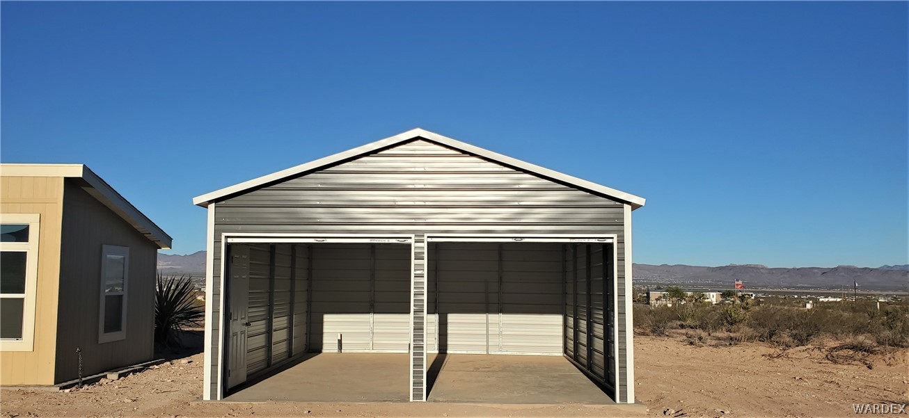 1434 Dilcon Road Golden Valley, AZ 86413 - Photo 5 of 49 a view of a house with a yard