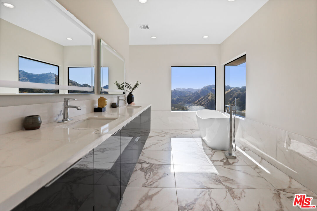 53 Saddlebow Road Bell Canyon, CA 91307 - Photo 37 of 66 a large white kitchen with a large window