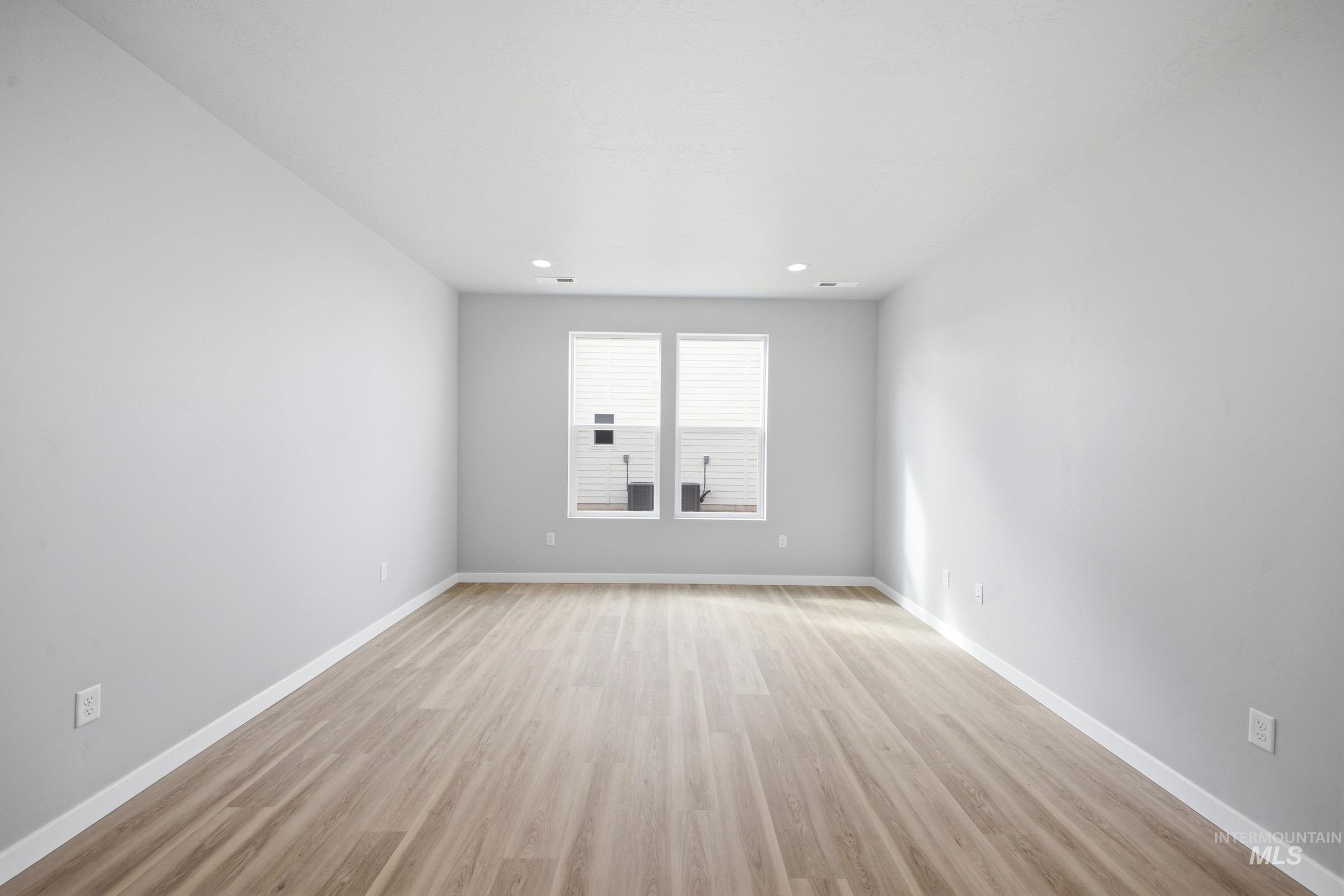 13672 Redway Court Caldwell, ID 83607 - Photo 12 of 34 Spare room featuring light wood-style flooring and recessed lighting
