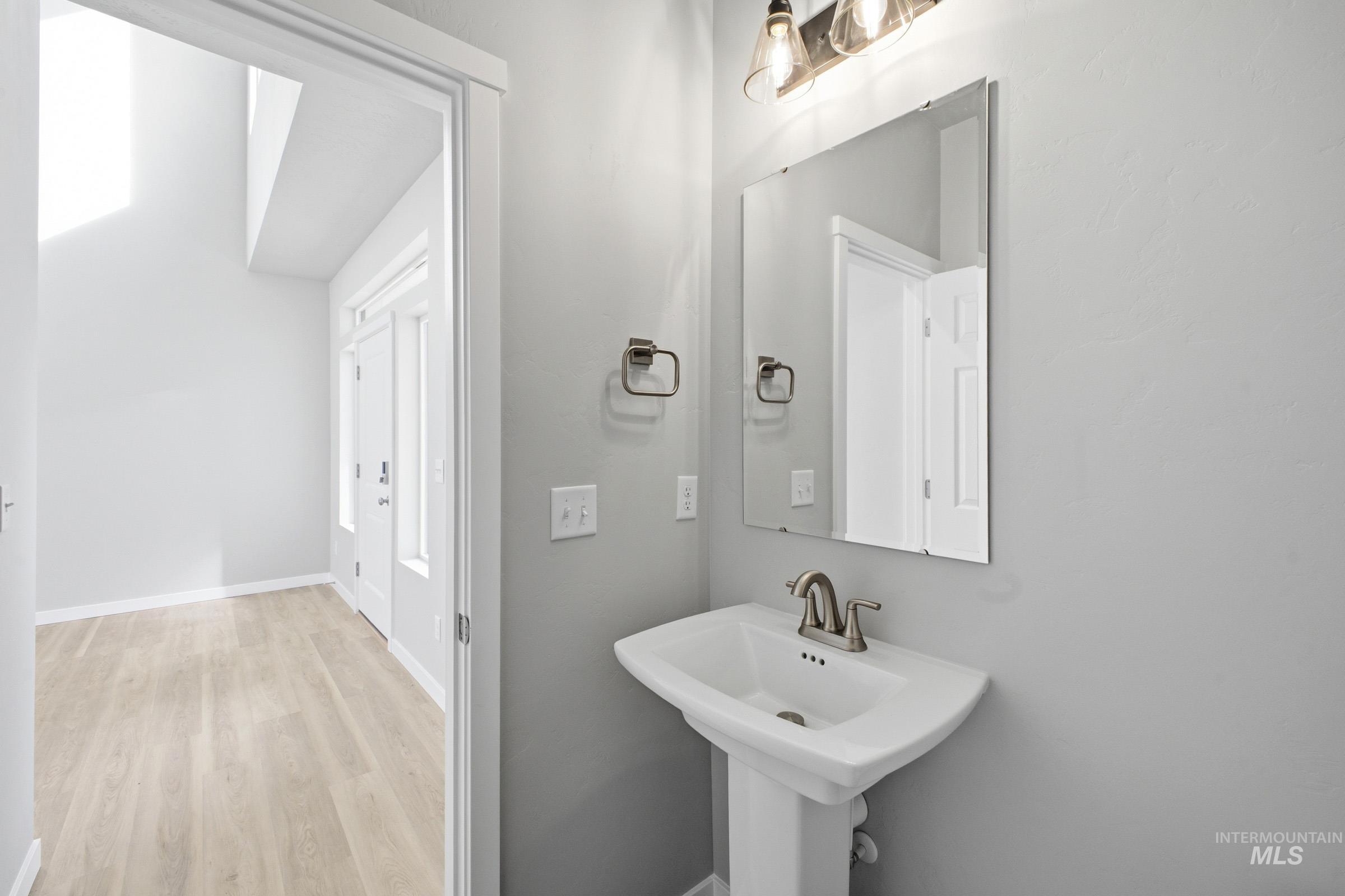 13672 Redway Court Caldwell, ID 83607 - Photo 13 of 34 Bathroom featuring light wood finished floors and baseboards