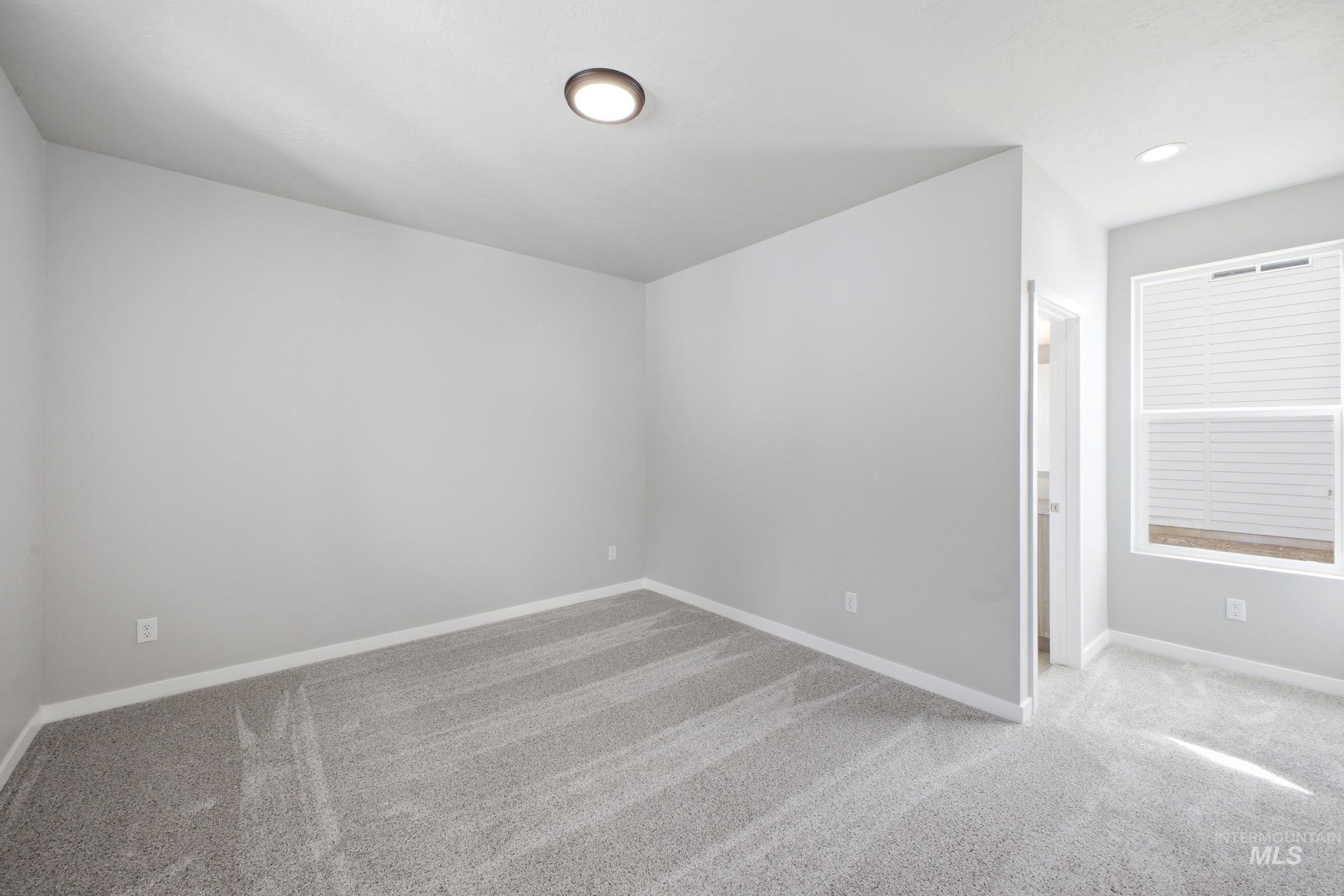 13672 Redway Court Caldwell, ID 83607 - Photo 14 of 34 Unfurnished room with light colored carpet and baseboards