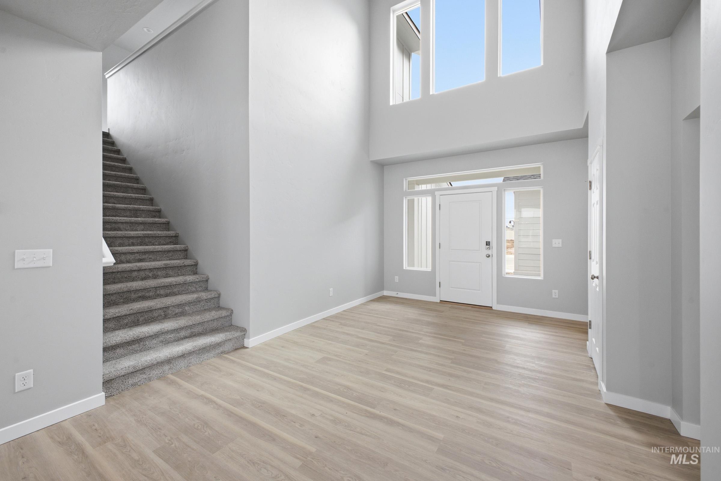 13672 Redway Court Caldwell, ID 83607 - Photo 2 of 34 Foyer with plenty of natural light, light wood-style flooring, and a high ceiling