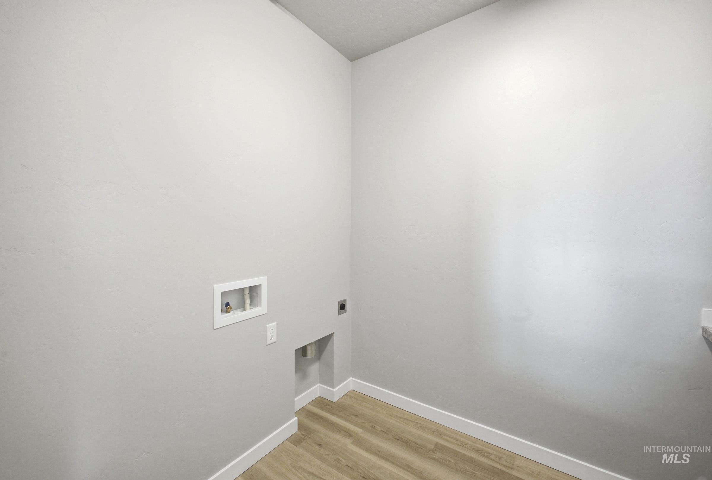 13672 Redway Court Caldwell, ID 83607 - Photo 22 of 34 Laundry room with hookup for a washing machine, light wood-style flooring, and electric dryer hookup