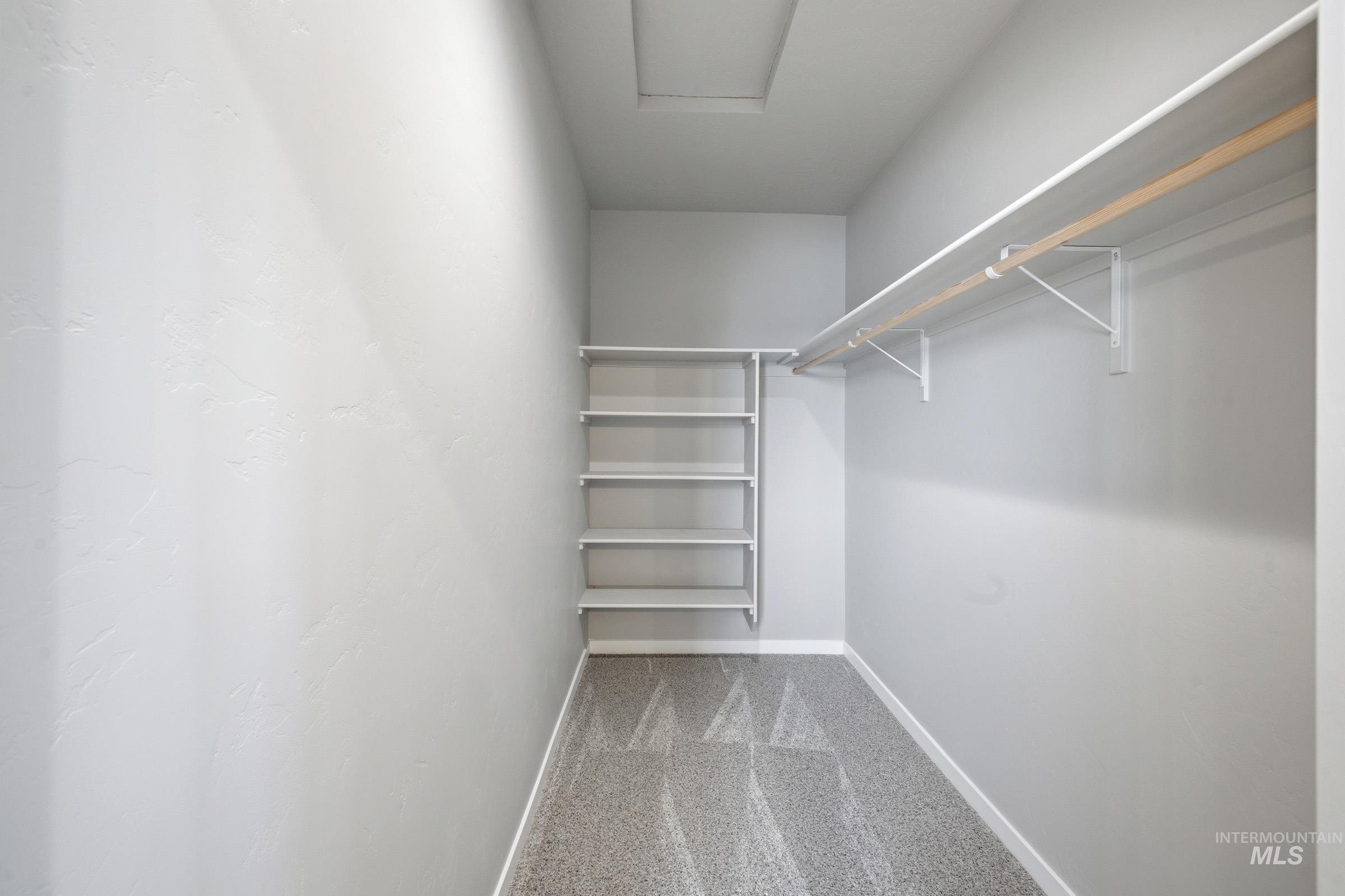 13672 Redway Court Caldwell, ID 83607 - Photo 32 of 34 Walk in closet featuring light carpet and attic access