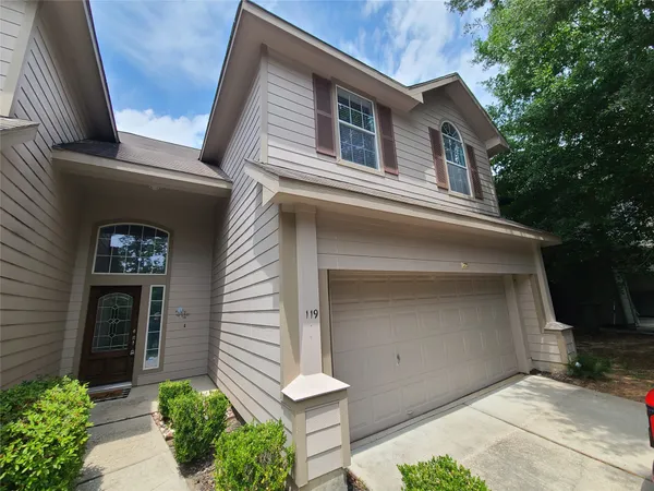 a front view of a house with a garage