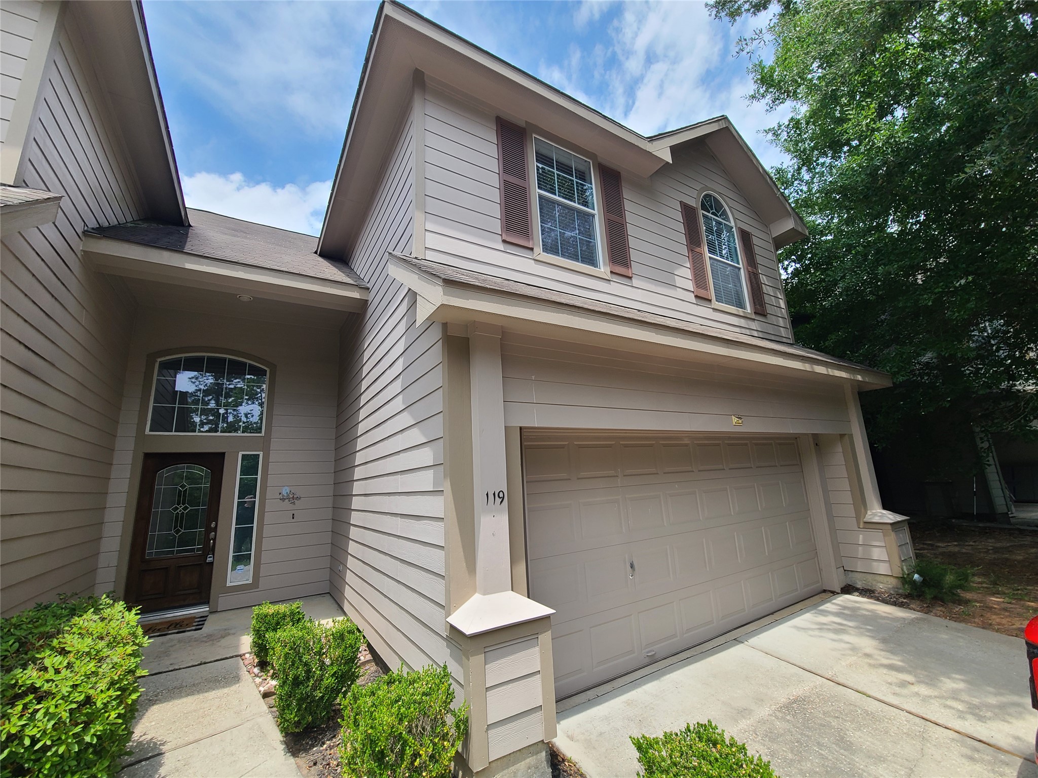 a front view of a house with a garage