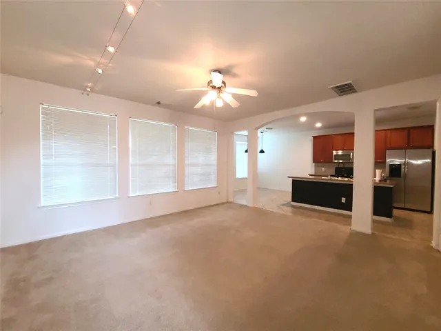 a view of a kitchen with a sink and a chandelier