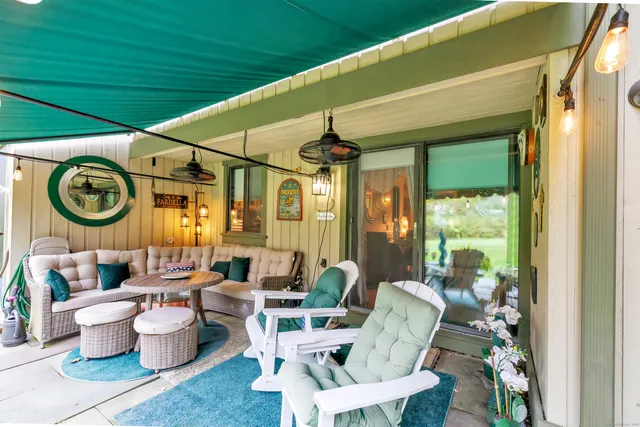 a living room with furniture and a large window