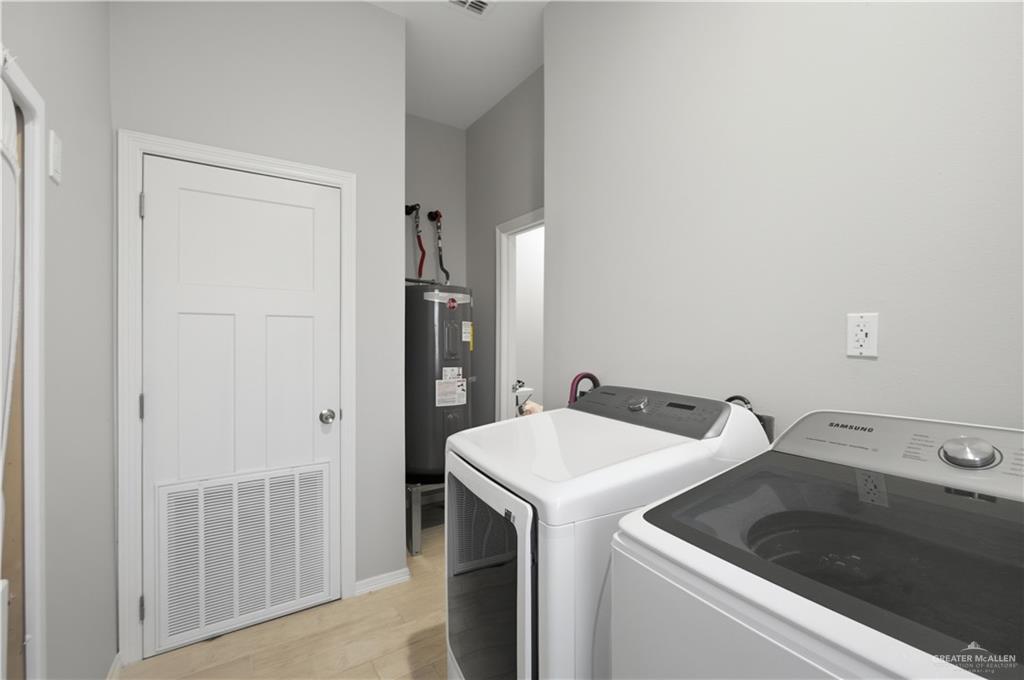 804 Hawk Street Alamo, TX 78516 - Photo 12 of 14 a utility room with dryer and washer