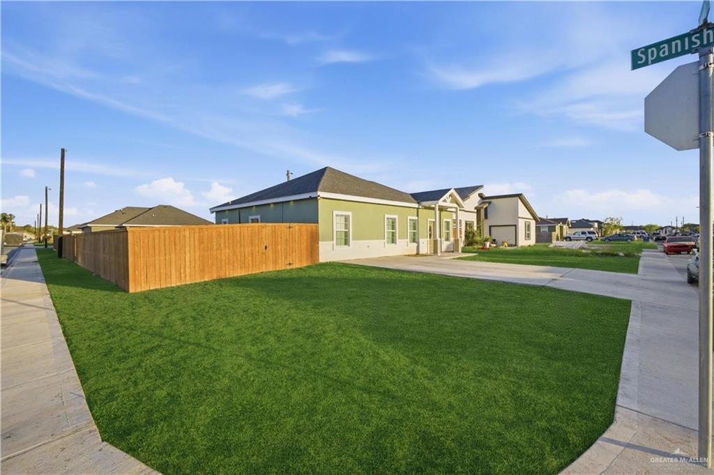 804 Hawk Street Alamo, TX 78516 - Photo 13 of 14 a view of a house with a back yard