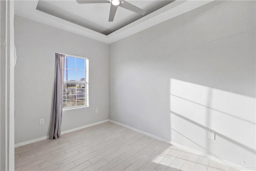 804 Hawk Street Alamo, TX 78516 - Photo 5 of 14 an empty room with windows