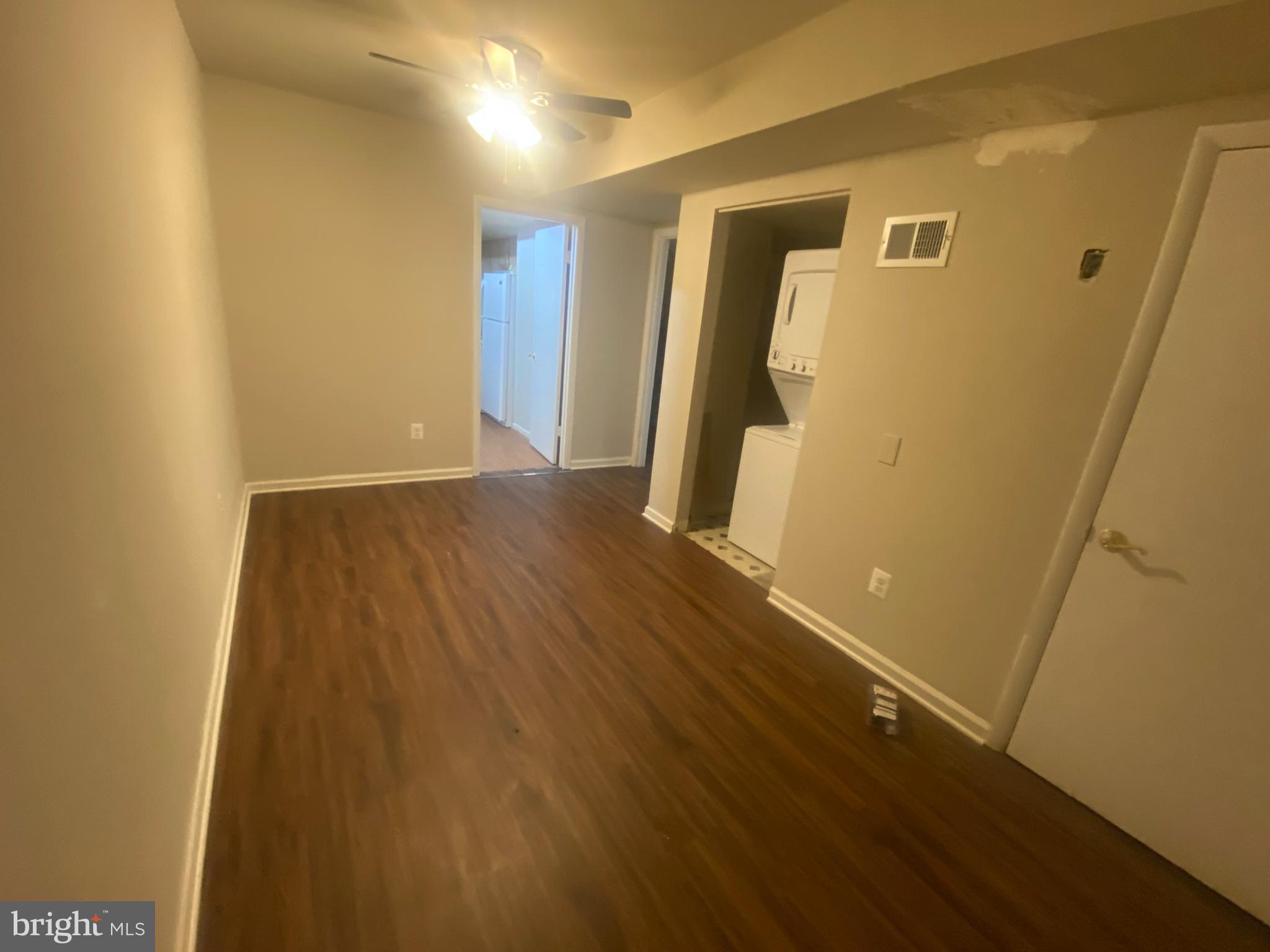 7307 Brooklyn Bridge Road Laurel, MD 20707 - Photo 4 of 9 a view of a hallway with wooden floor
