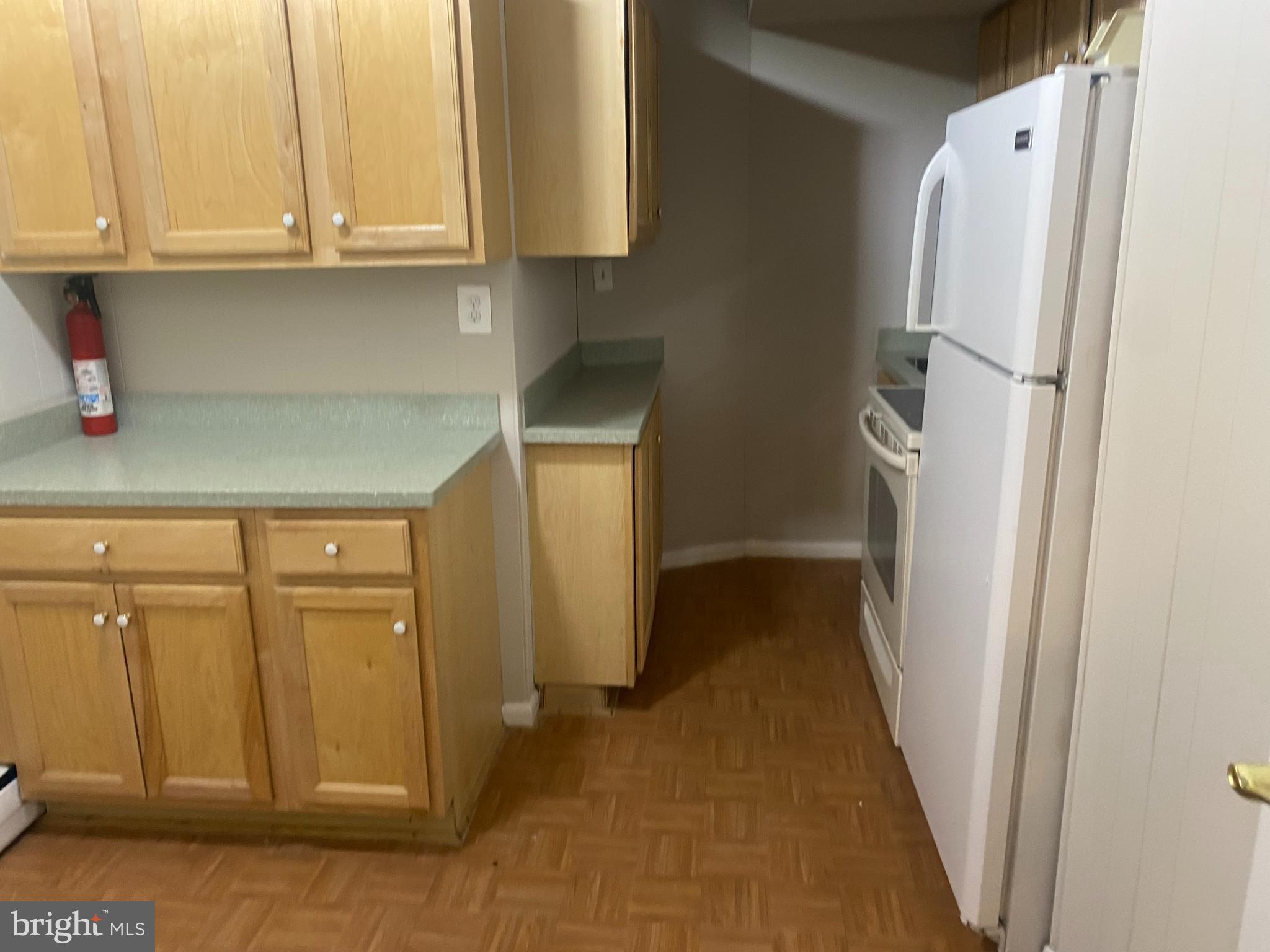7307 Brooklyn Bridge Road Laurel, MD 20707 - Photo 5 of 9 a view of a refrigerator and cabinets