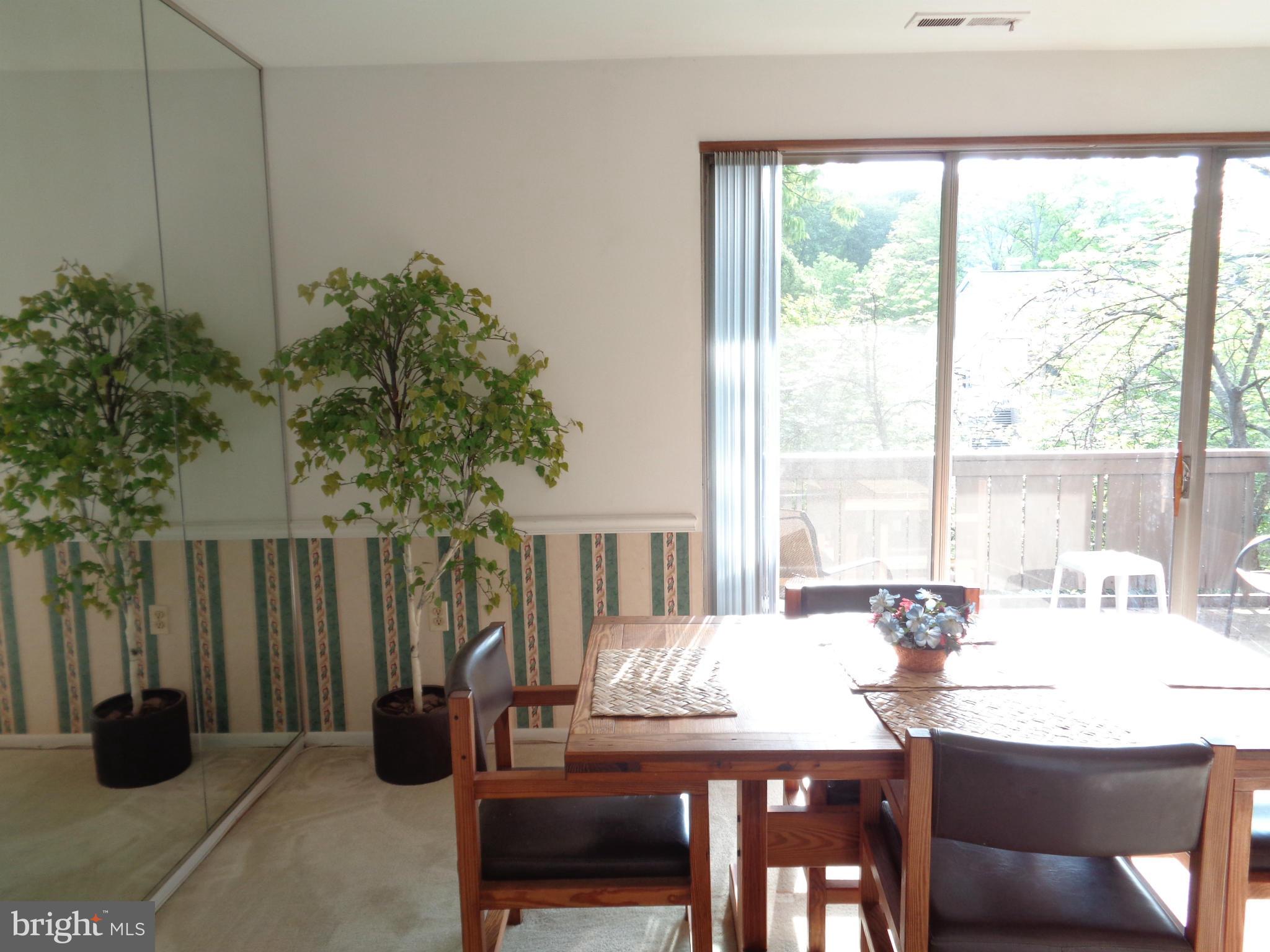 114 Cross Keys Road, Unit R114D Baltimore, MD 21210 - Photo 6 of 22 a dining room with furniture and window
