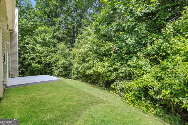 a view of a yard with a tree