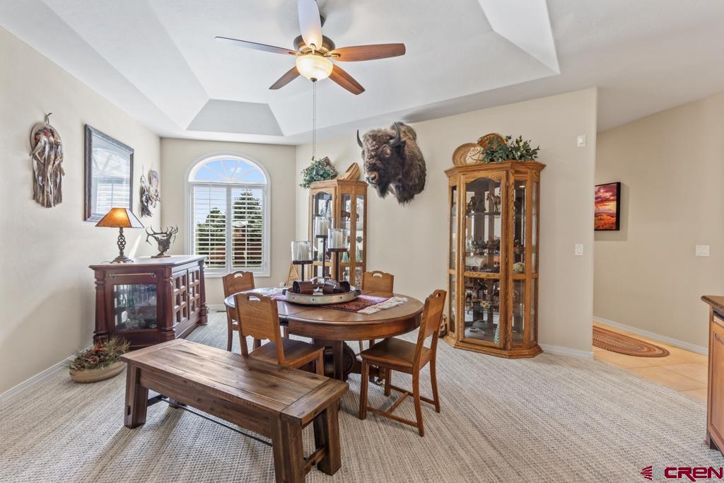 15103 6260th Road Montrose, CO 81403 - Photo 13 of 45 a view of a dining room with furniture window and wooden floor