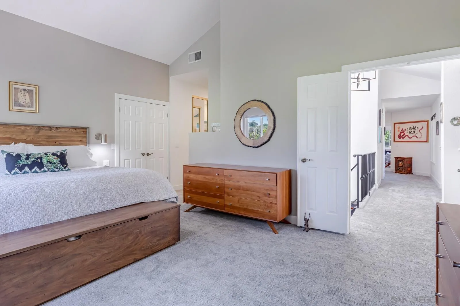 14921 Tercer Verde Del Mar, CA 92014 - Photo 16 of 37 a bedroom with a bed and a clock on the dresser