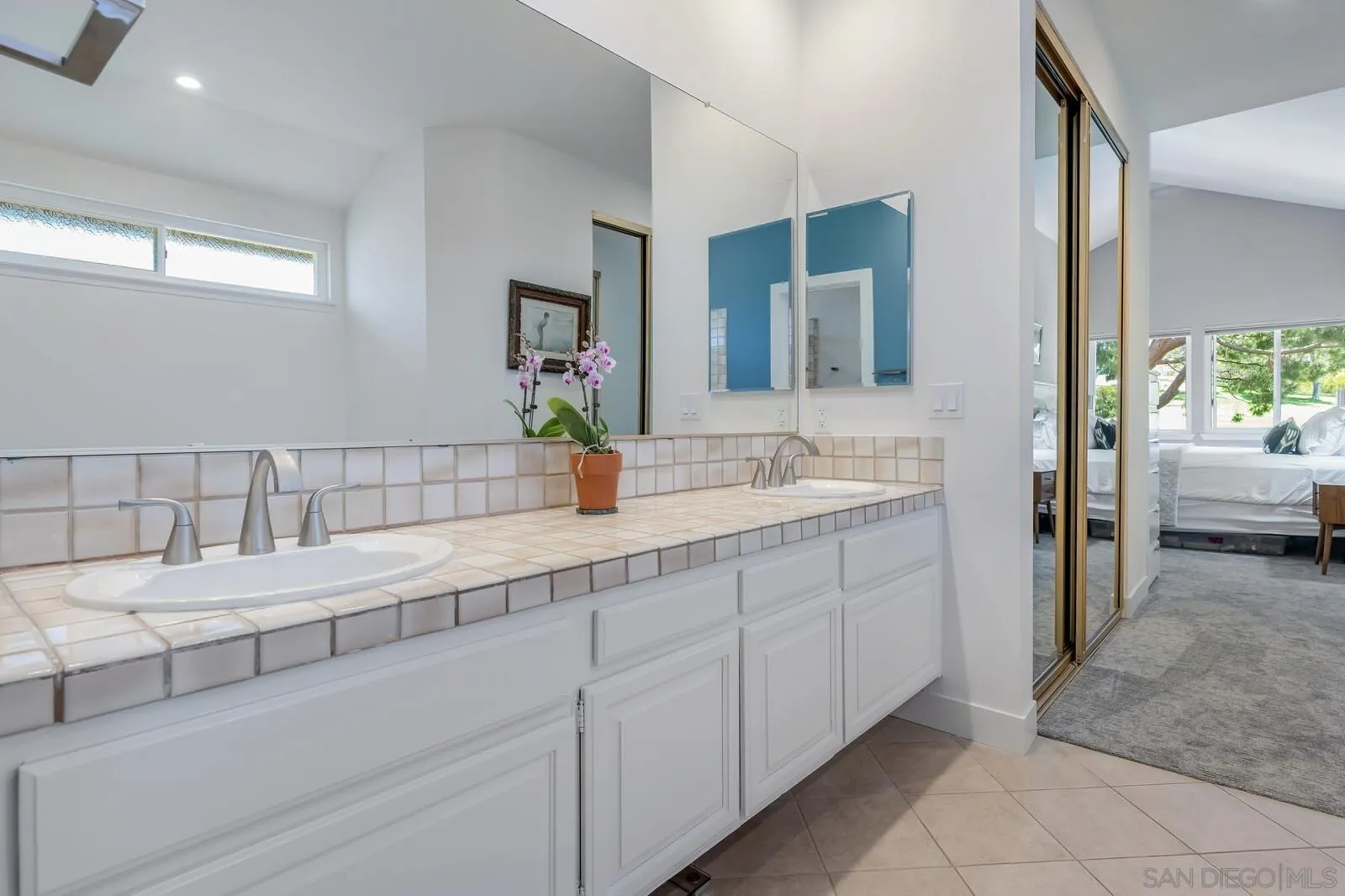 14921 Tercer Verde Del Mar, CA 92014 - Photo 21 of 37 a bathroom with a sink and a mirror