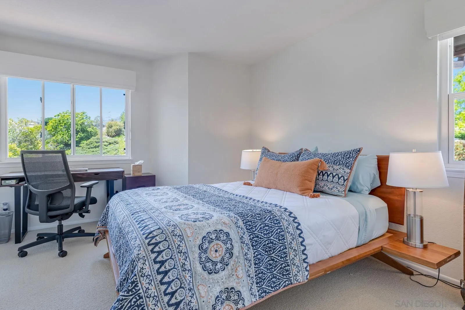 14921 Tercer Verde Del Mar, CA 92014 - Photo 22 of 37 a bedroom with a bed a table and a chair