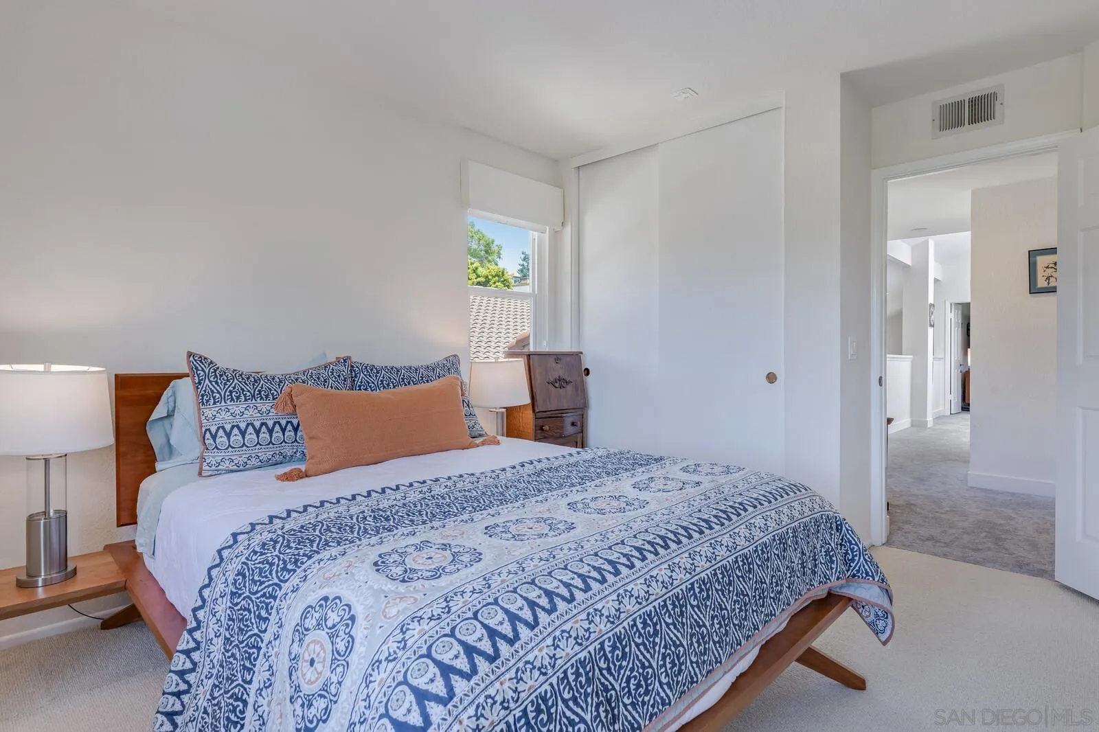 14921 Tercer Verde Del Mar, CA 92014 - Photo 23 of 37 a bedroom with a bed and a window