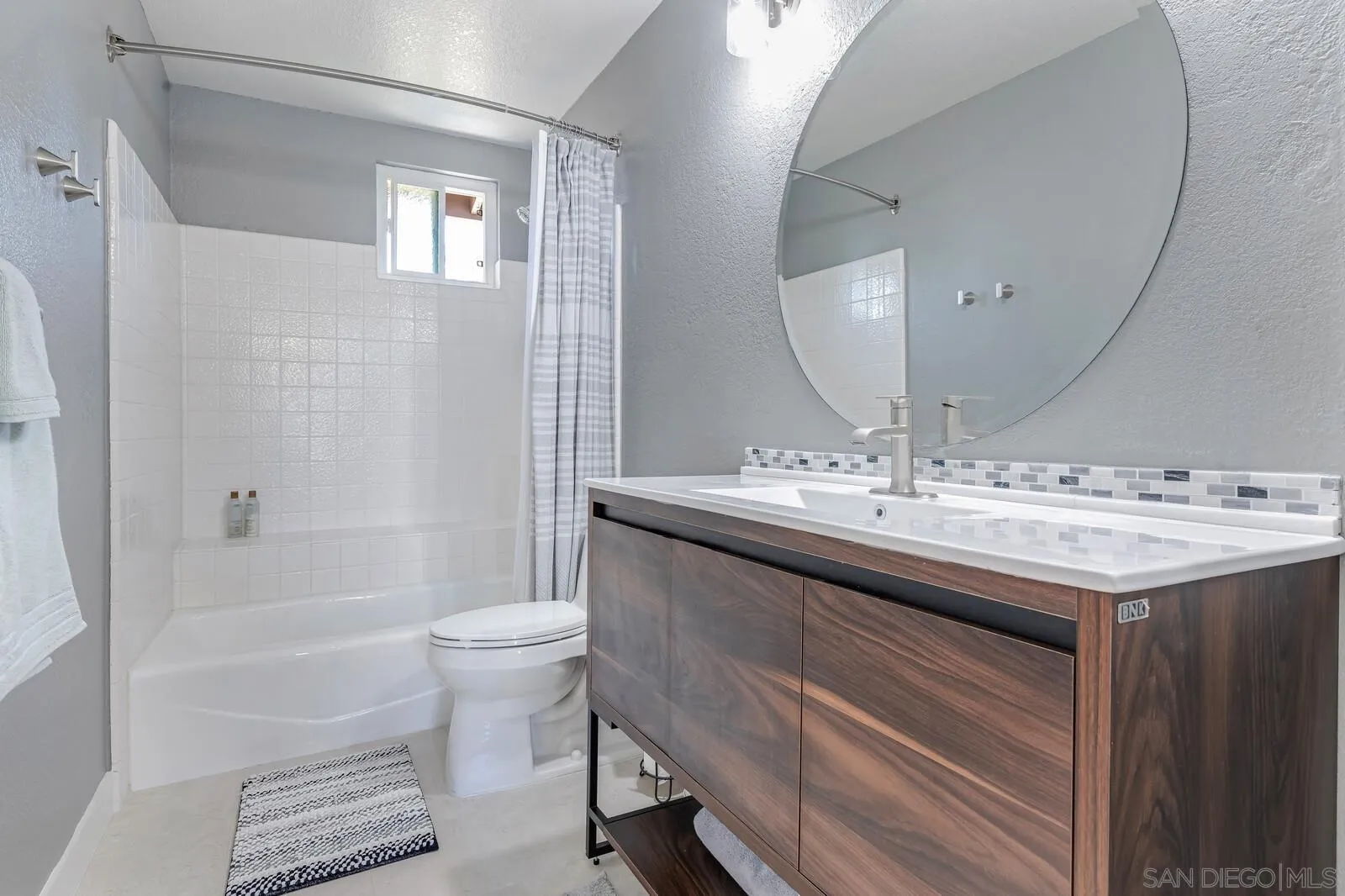 14921 Tercer Verde Del Mar, CA 92014 - Photo 24 of 37 a bathroom with a sink a toilet and shower