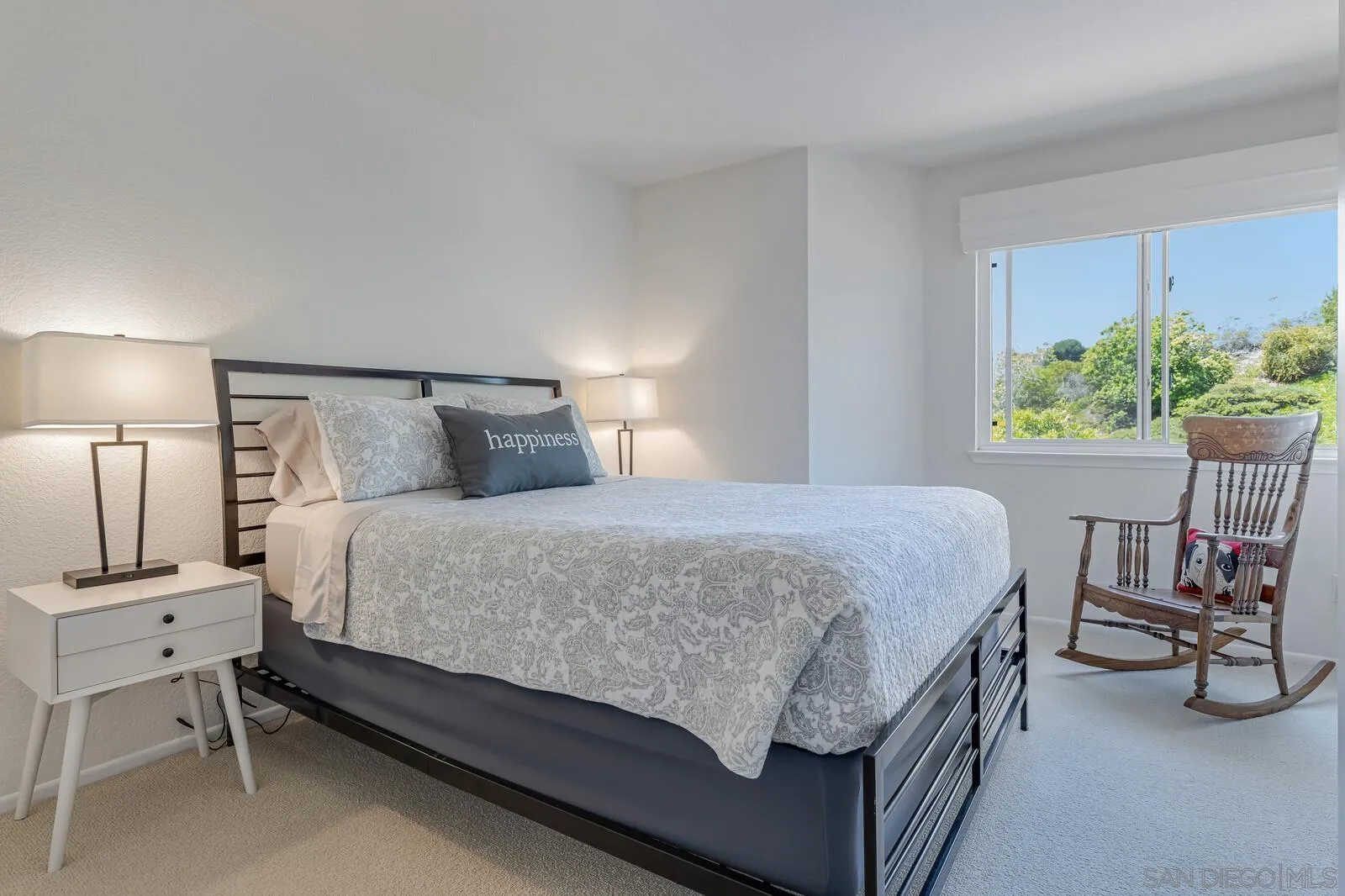 14921 Tercer Verde Del Mar, CA 92014 - Photo 25 of 37 a bedroom with a bed and a chair