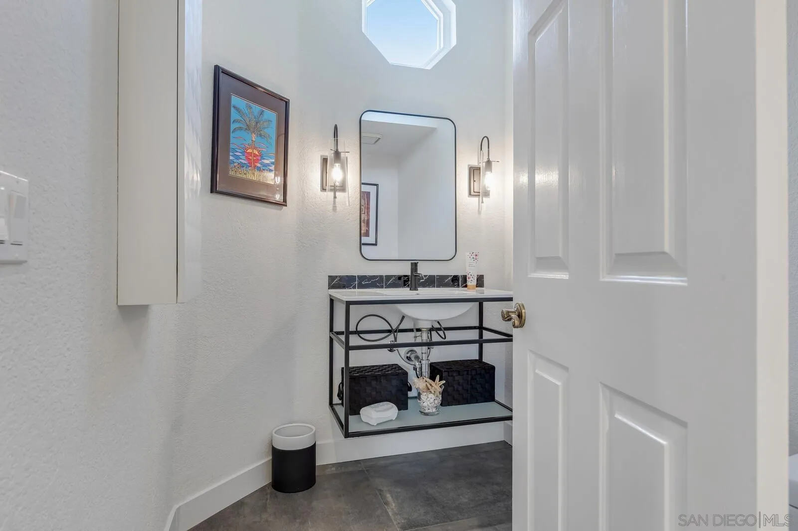 14921 Tercer Verde Del Mar, CA 92014 - Photo 29 of 37 a bathroom with a sink and a mirror