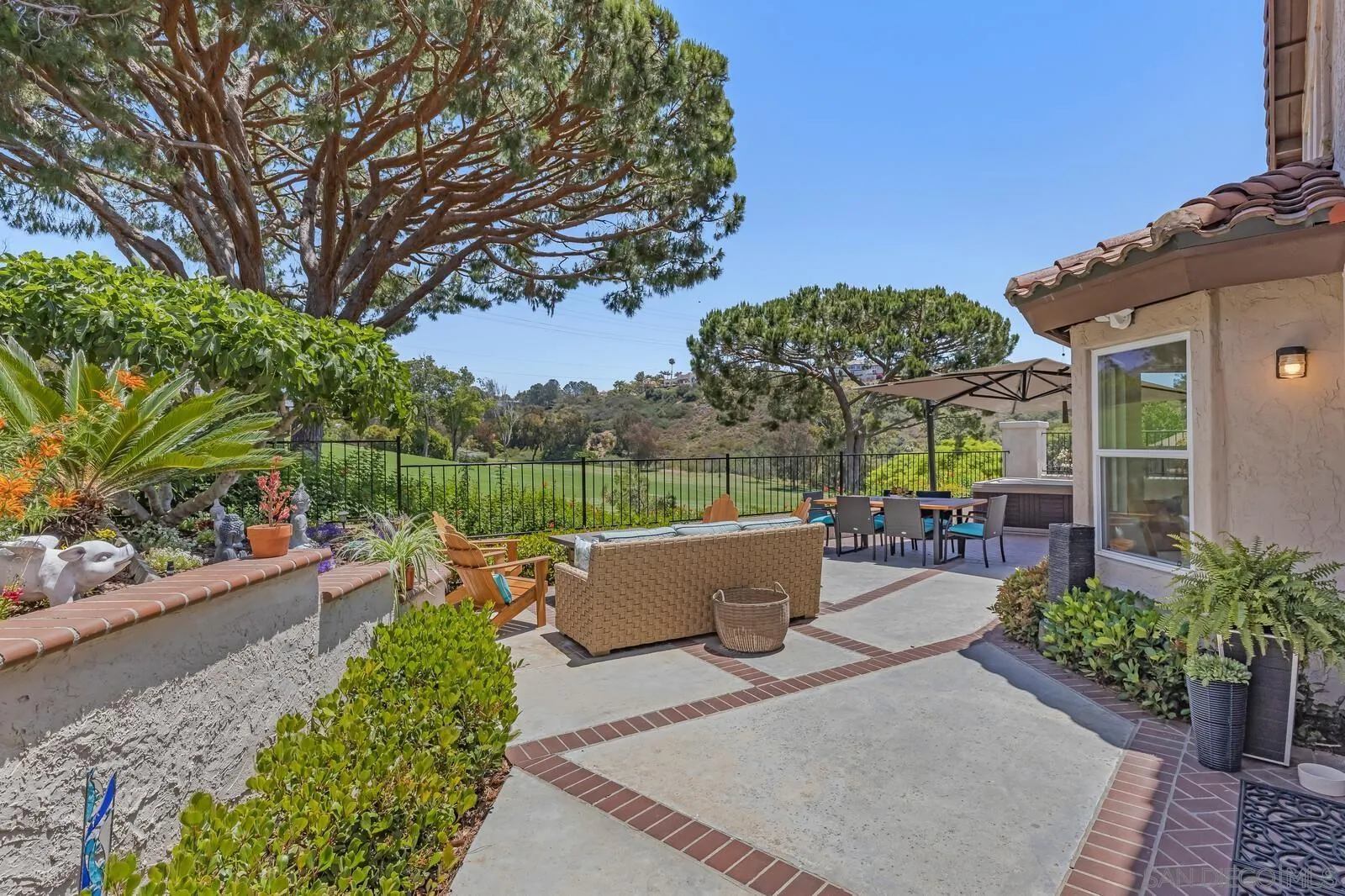 14921 Tercer Verde Del Mar, CA 92014 - Photo 30 of 37 a view of a patio with couches and potted plants