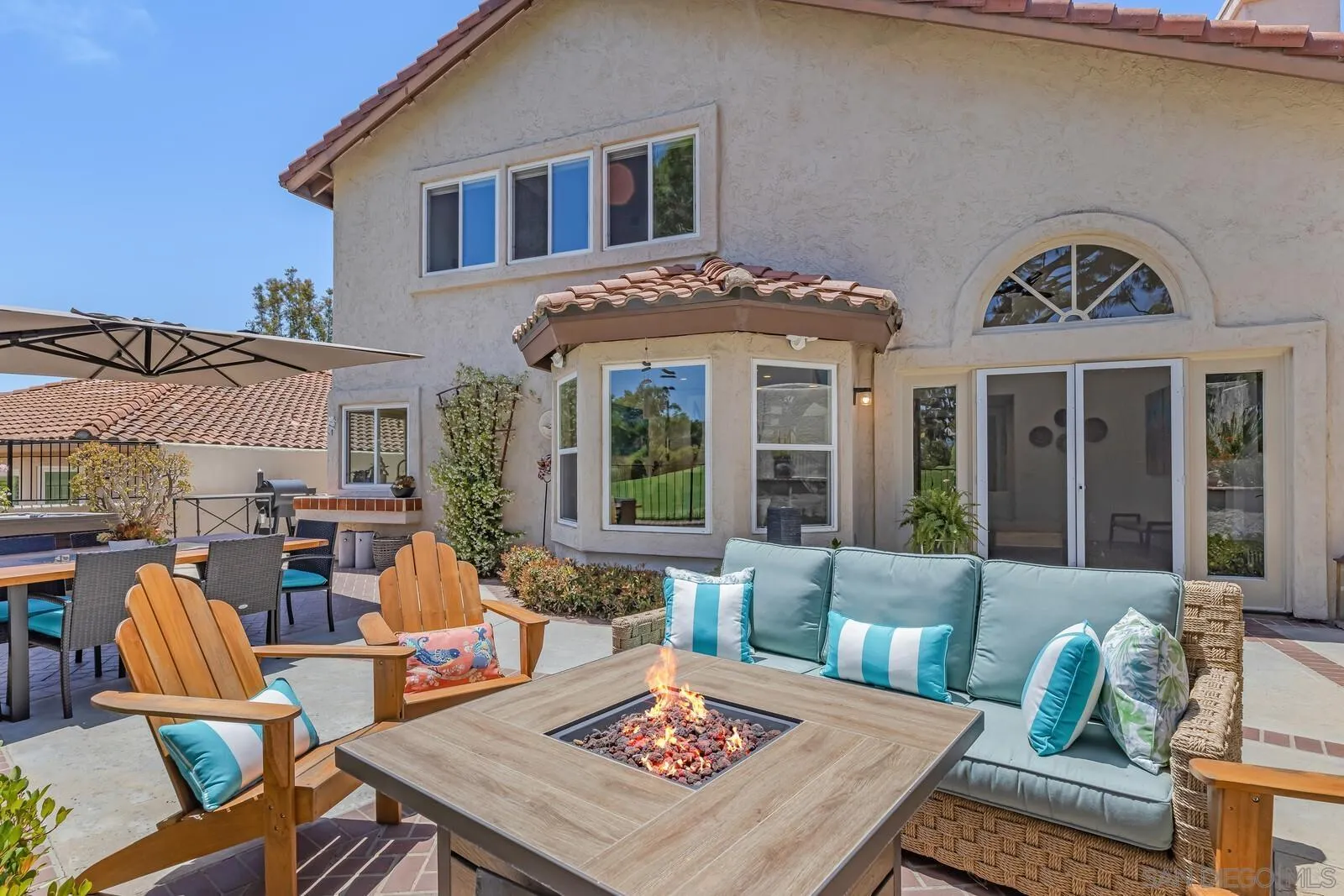 14921 Tercer Verde Del Mar, CA 92014 - Photo 32 of 37 a view of a patio with couches table and chairs and potted plants
